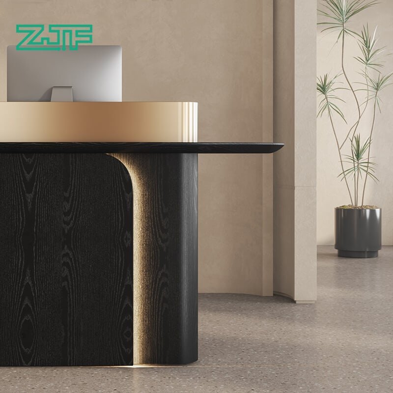 Compact reception counter with black wood and gold U-shape