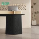 Black wood grain reception counter with gold trim